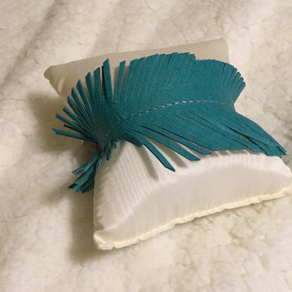 New w/ tag. Teal leather feather bracelet.